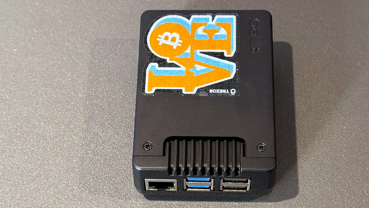 Fully assembled Raspberry Pi 5 Bitcoin node, with obligatory sticker.